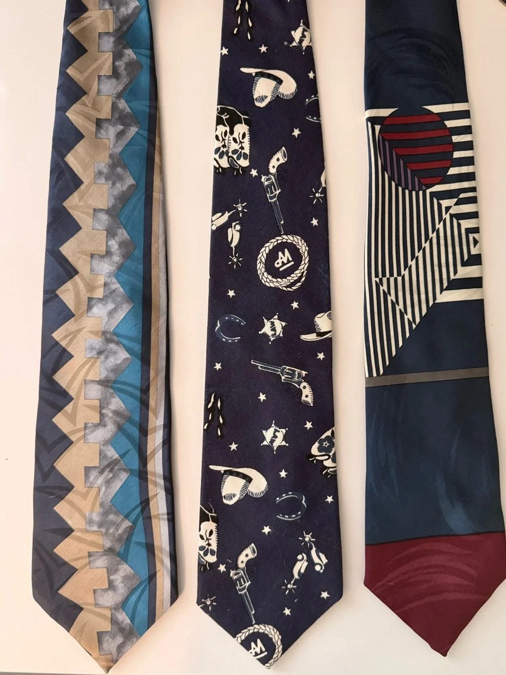Three neckties. Oscar de la Renta, Oleg Cassini, Tango vintage ties.